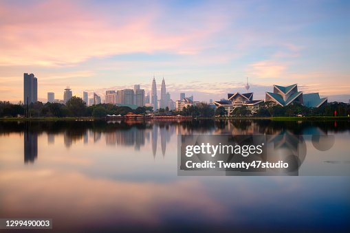 Panoramic Kuala Lumpur cityscape reflects on lake from Titiwangsa park in Malaysia Panoramic Kuala Lumpur cityscape reflects on lake from Titiwangsa park in Malaysia
