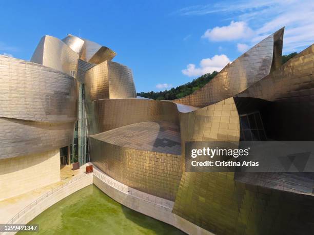 View of Guggenheim Museum designed by architect Frank O. Gehry, innovative building made up of curvilinear and twisted shapes, covered with...