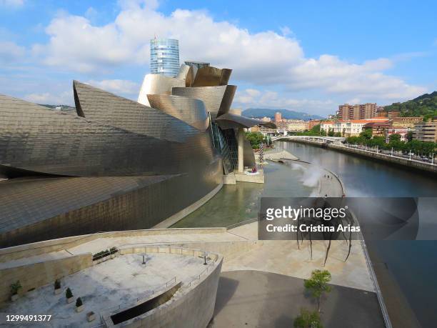 View of Guggenheim Museum designed by architect Frank O. Gehry with Mama sculpture designed by Louise Bourgeois in Bilbao, Vizcaya, Spain.