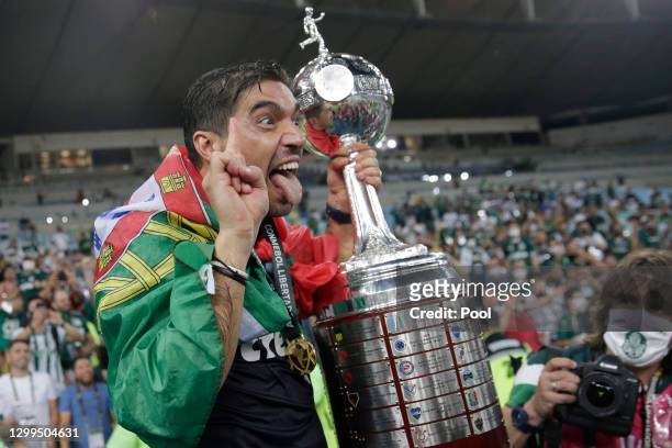 Coach of Palmeiras Abel Ferreira holds the Copa CONMEBOL Libertadores champions trophy after against Santos at Maracanã Stadium on January 30, 2021...