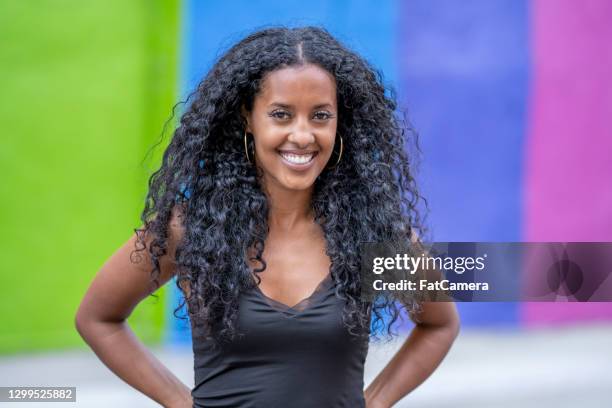 beautiful african woman in front of pride mural - black lives matter mural stock pictures, royalty-free photos & images