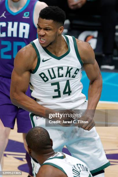 Giannis Antetokounmpo of the Milwaukee Bucks reacts following a dunk during the third quarter of their game against the Charlotte Hornets at Spectrum...