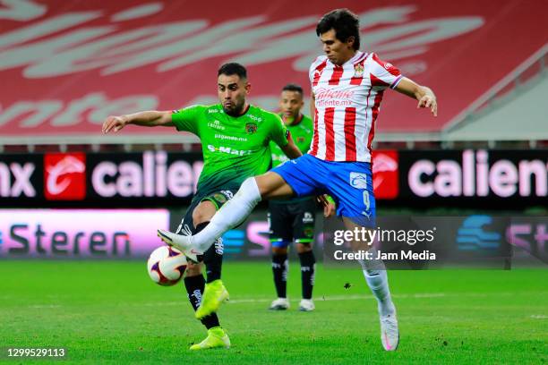 Jose Esquivel of Juarez fights for the ball with Jose Macias of Chivas during the 4th round match between Chivas and FC Juarez as part of the Torneo...