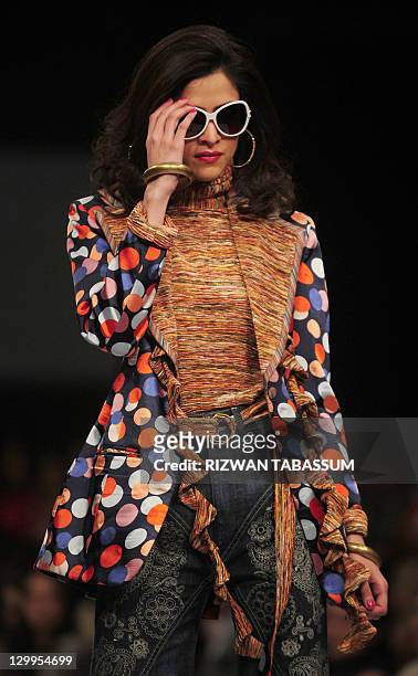 Model presents a creation by fashion designer Ammar Belal during PFDC Sunsilk Fashion Week in Karachi on October 22, 2011. AFP PHOTO / RIZWAN TABASSUM