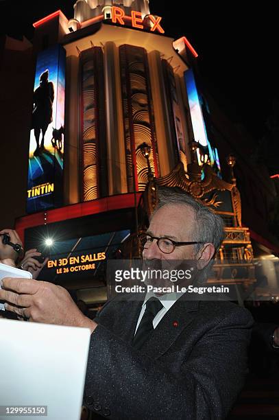 Steven Spielberg signs autographs during the 'TINTIN: The Secret Of The Unicorn' World Premiere at Le Grand Rex on October 22, 2011 in Paris, France.