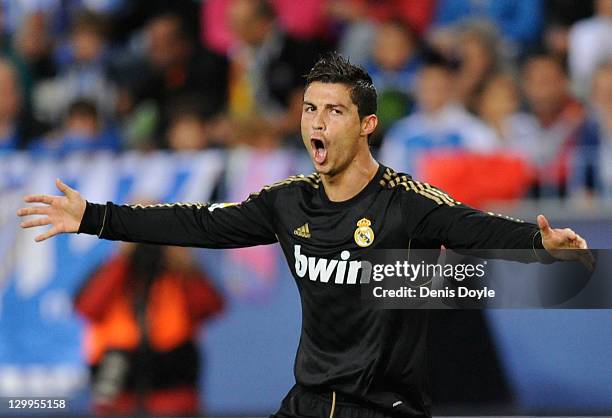 Cristiano Ronaldo of Real Madrid celebrates after scoring his 2nd goal during the La Liga match between Malaga CF and Real Madrid CF at Estadio La...
