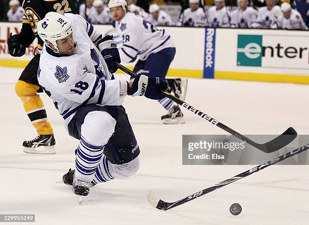 Mike Brown of the Toronto Maple Leafs tries to take a shot in the second period against the Boston Bruins on October 20, 2011 at TD Garden in Boston,...