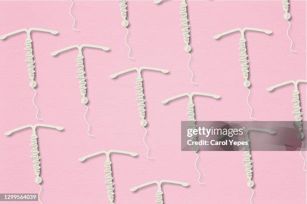 iud.concept hormonal contraception on a pink background - wound stock pictures, royalty-free photos & images