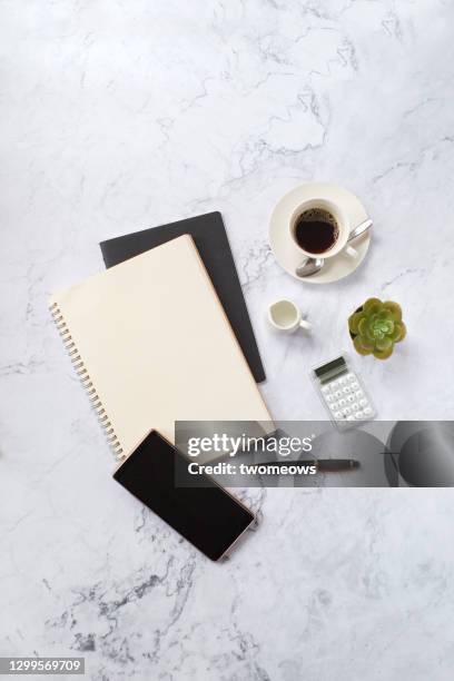 flat lay daily financial objects on marble coffee table top still life. - mesa de café imagens e fotografias de stock