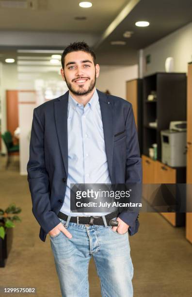 standing office worker looking at camera smiling - bank office clerks stock pictures, royalty-free photos & images