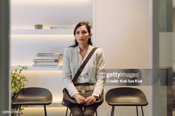 unemployed middle aged candidate at the waiting area before interview - job interview nervous stock pictures, royalty-free photos & images