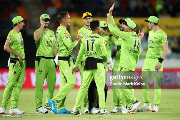 Of the Thunder celebrates the run out of Marnus Labuschagne of the Heat by Chris Green of the Thunder during the Big Bash League match between the...