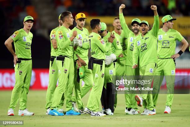 The Thunder celebrate the run out of Marnus Labuschagne of the Heat by Chris Green of the Thunder during the Big Bash League match between the Sydney...