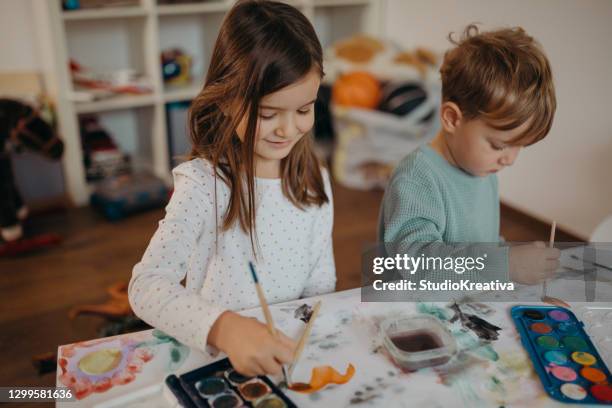 brother and sister painting - malfarbe stock pictures, royalty-free photos & images