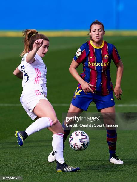 Patri Guijarro of FC Barcelona Women competes for the ball with Teresa Abelleira of Real Madrid during the Primera Division Femenina match between FC...