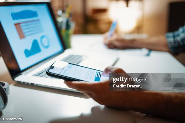 millennial man investing stock market analysis during trading cryptocurrency on laptop - financial forum stock pictures, royalty-free photos & images