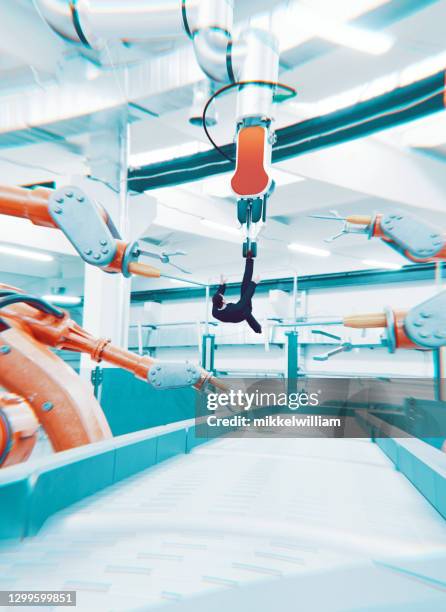 concept image of robots taking control over human life - robots taking over stock pictures, royalty-free photos & images