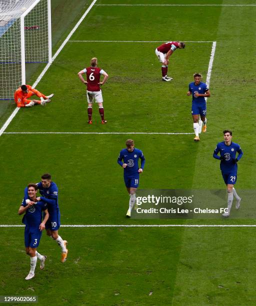 Marcos Alonso of Chelsea celebrates with team mate Christian Pulisic after scoring their side's second goal as Nick Pope and Erik Pieters of Burnley...