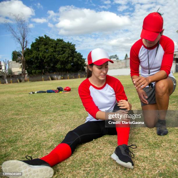 injured baseball player - softball sport stock pictures, royalty-free photos & images