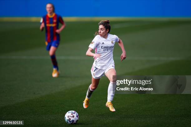 Olga Carmona of Real Madrid runs with the ball during the Primera Division Femenina match between FC Barcelona and Real Madrid at Johan Cruyff...