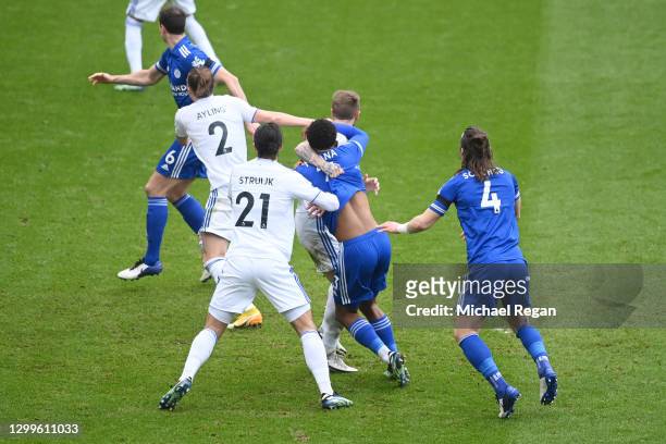 Liam Cooper of Leeds United and Wesley Fofana of Leicester City tussle in the box which VAR reviewed only to be later dismissed during the Premier...