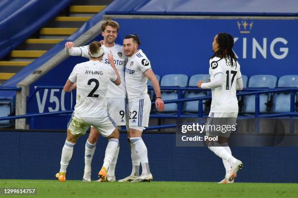 Jack Harrison of Leeds United celebrates with team mates Luke Ayling, Patrick Bamford and Helder Costa after scoring their side's third goal during...