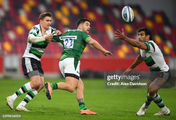 Terrence Hepetema of London Irish offloads under pressure from Toby Flood and Matias Orlando of Newcastle Falcons during the Gallagher Premiership...