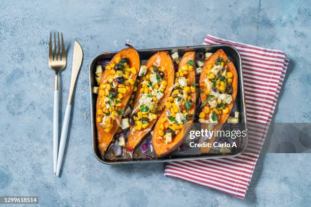 baked sweet potatoes with corn tofu olives - zoete aardappel stockfoto's en -beelden