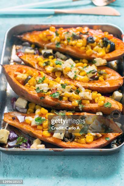 baked sweet potatoes with corn tofu olives - sweet potato stock pictures, royalty-free photos & images