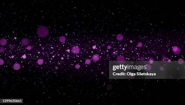 purple defocused lights on black background - glitter black background stock pictures, royalty-free photos & images