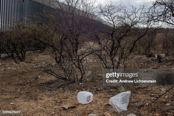 Trash left by migrants recently returned after being deported from the United States, or getting ready to try and cross again, litters the ground...