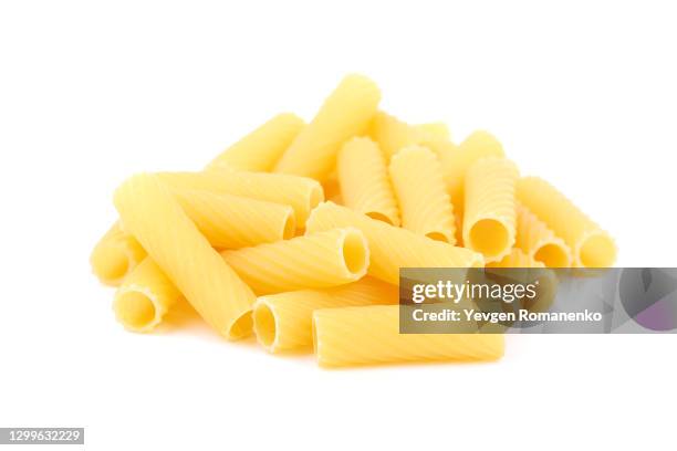 heap of tortiglioni pasta isolated on white background - macaroni stock pictures, royalty-free photos & images