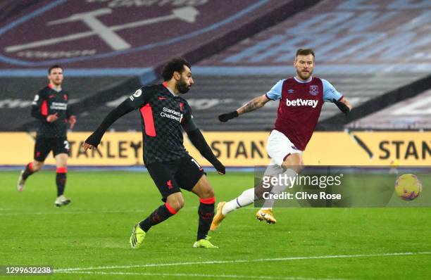 Mohamed Salah of Liverpool scores their side's second goal during the Premier League match between West Ham United and Liverpool at London Stadium on...