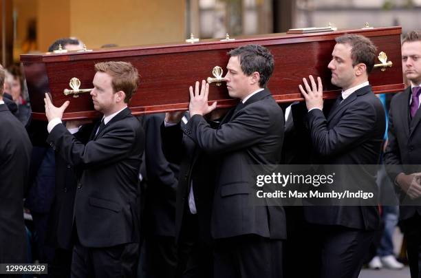 The coffin of 'Coronation Street' actress Betty Drivr is carried into St. Ann's Church for her funeral on October 22, 2011 in Manchester, England.