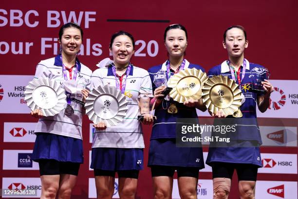 Kim So Yeong, Kong Hee Yong, Shin Seung Chan and Lee So Hee of Korea pose with their trophies after the Women’s Double final match on day five of the...