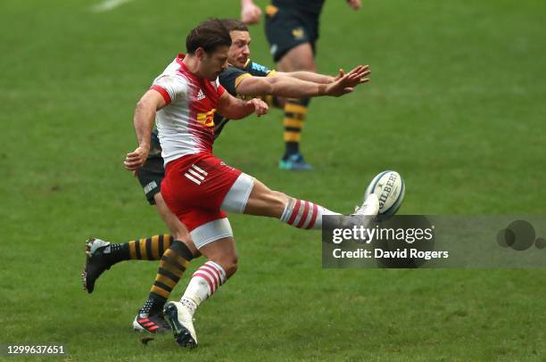 Danny Care of Harlequins kicks the ball upfield as Jimmy Gopperth challenges during the Gallagher Premiership Rugby match between Wasps and...