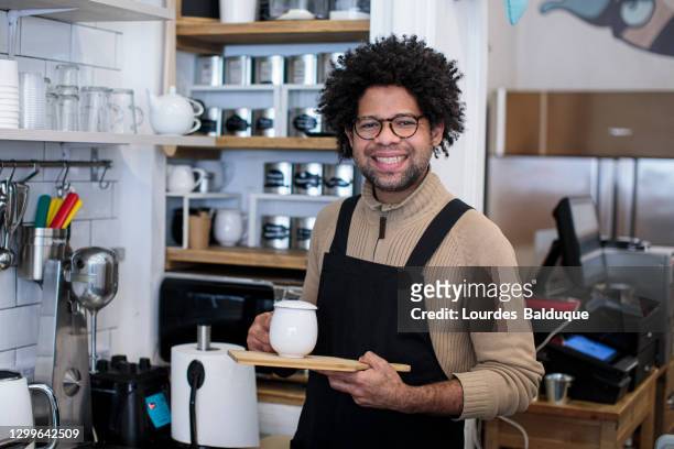 man working in coffee shop - black apron stock pictures, royalty-free photos & images