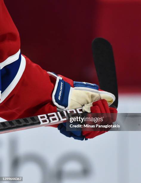 Hockey glove and stick with Bauer branding is seen during the third period between the Montreal Canadiens and the Calgary Flames at the Bell Centre...