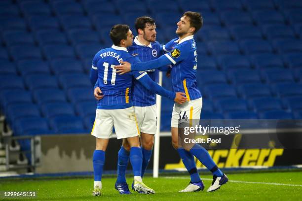 Leandro Trossard of Brighton & Hove Albion celebrates with team mates Pascal Gross and Joel Veltman after scoring their side's first goal during the...