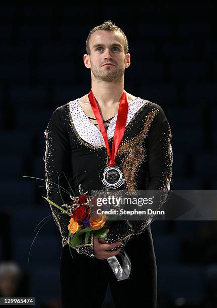 Kevin Van Der Perren of Belgium stands with his silver medal after the men's competition during Hilton HHonors Skate America at Citizens Business...