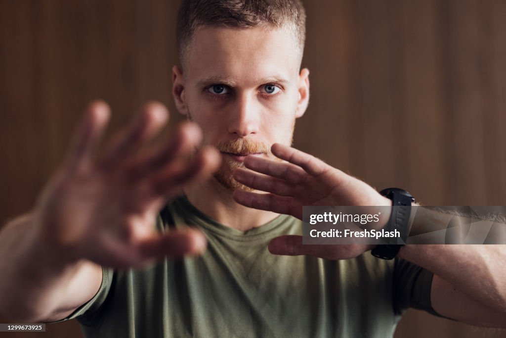 Handsome Young Man Practicing Martial Arts - a Close Up