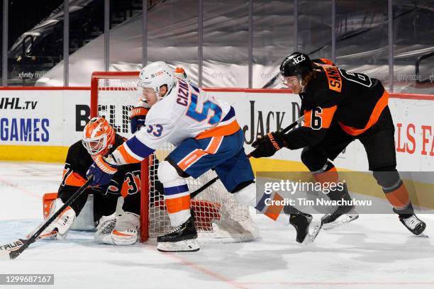 Brian Elliott of the Philadelphia Flyers blocks Casey Cizikas of the New York Islanders during the second period at Wells Fargo Center on January 31,...