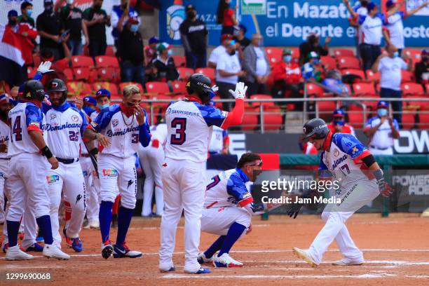 Juan Lagares of Águilas Cibaeñas from Dominican Republic celebrates with teammate during the game between Puerto Rico and Dominican Republic as part...