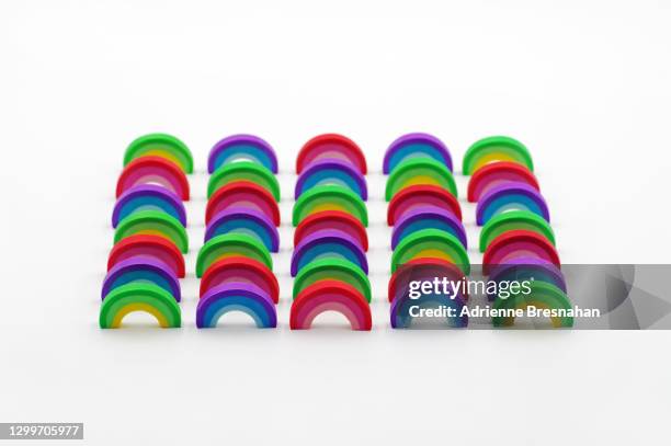 rainbow connection - rows of rainbows on white background - pink eraser stock pictures, royalty-free photos & images