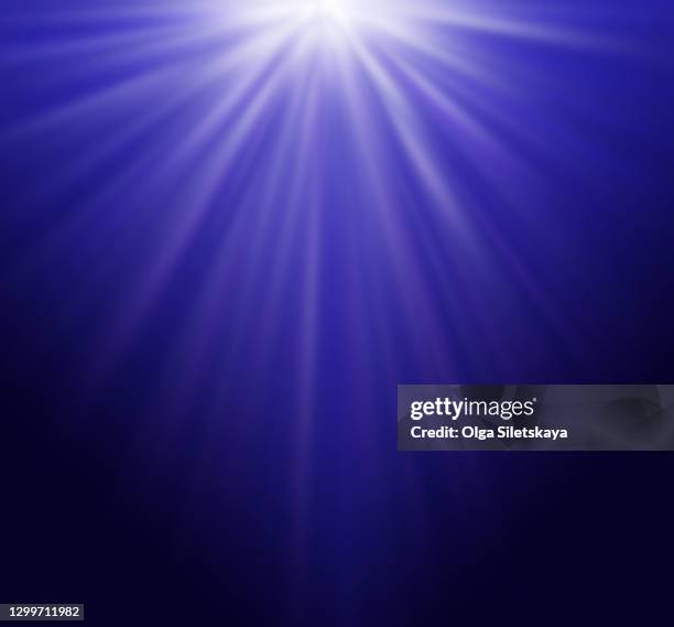 dark blue abstract background with rays of light - jet de flamme photos et images de collection