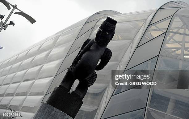 Carving of "Rongomatane" , the Maori god of peace, stands alongside the new south stand of the Eden Park stadium in Auckland during the 2011 Rugby...