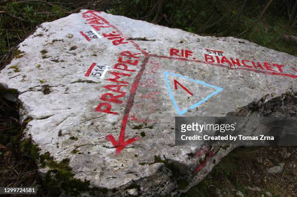 alta via 1 sign on a big boulder - dolomites italy stock pictures, royalty-free photos & images