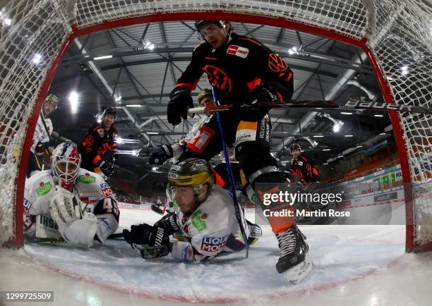 Matti Järvinen of Grizzlys Wolfsburg tries to score over Tobias Ancicka, goaltender of Eisbären Berlin during the Deutsche Eishockey Liga DEL match...