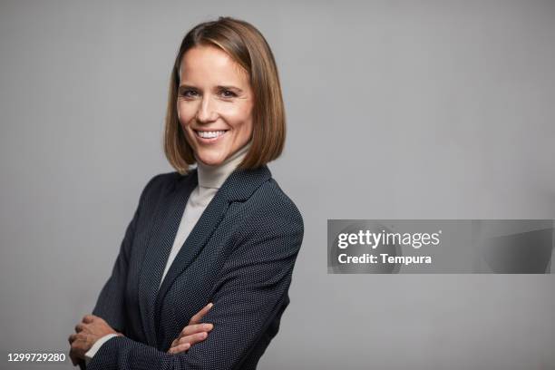 businesswoman looking at the camera - high collar stock pictures, royalty-free photos & images