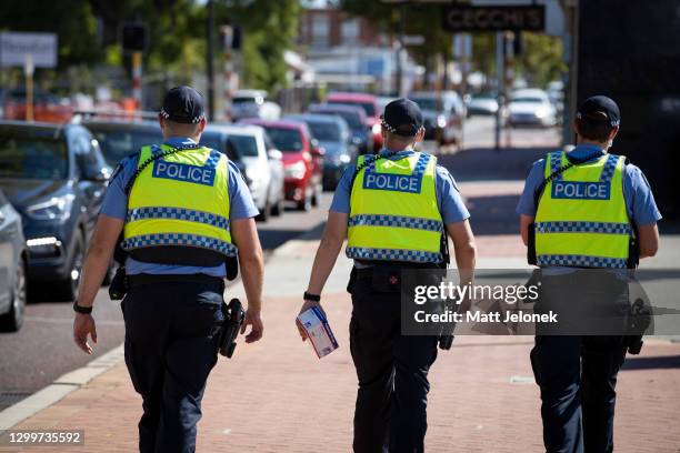 Police are seen on patrol at a Covid-19 drive through clinic in Inglewood where members of the public have been waited over two hours in line on...